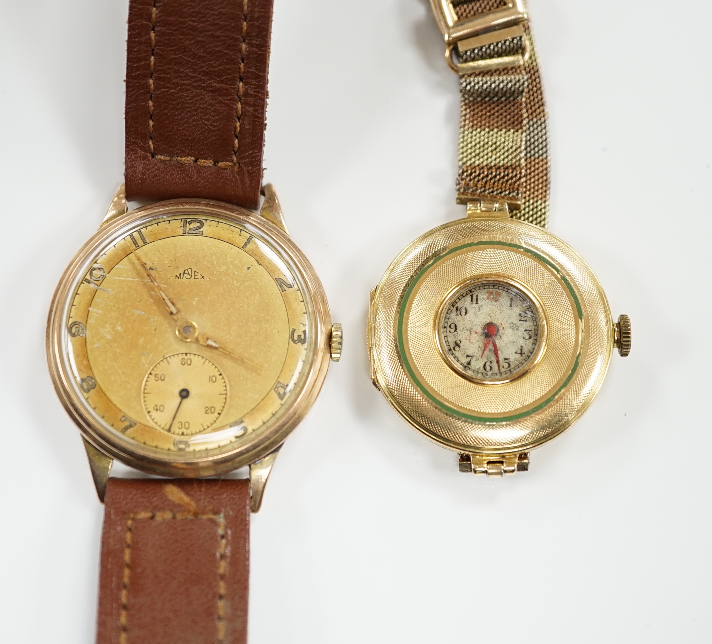 An early 20th century 18ct gold manual wind wrist watch, by Wilsdorf & Davies, on a later three colour 9ct mesh link bracelet and a gentleman's yellow metal Majex manual wind wrist watch, on a leather strap.